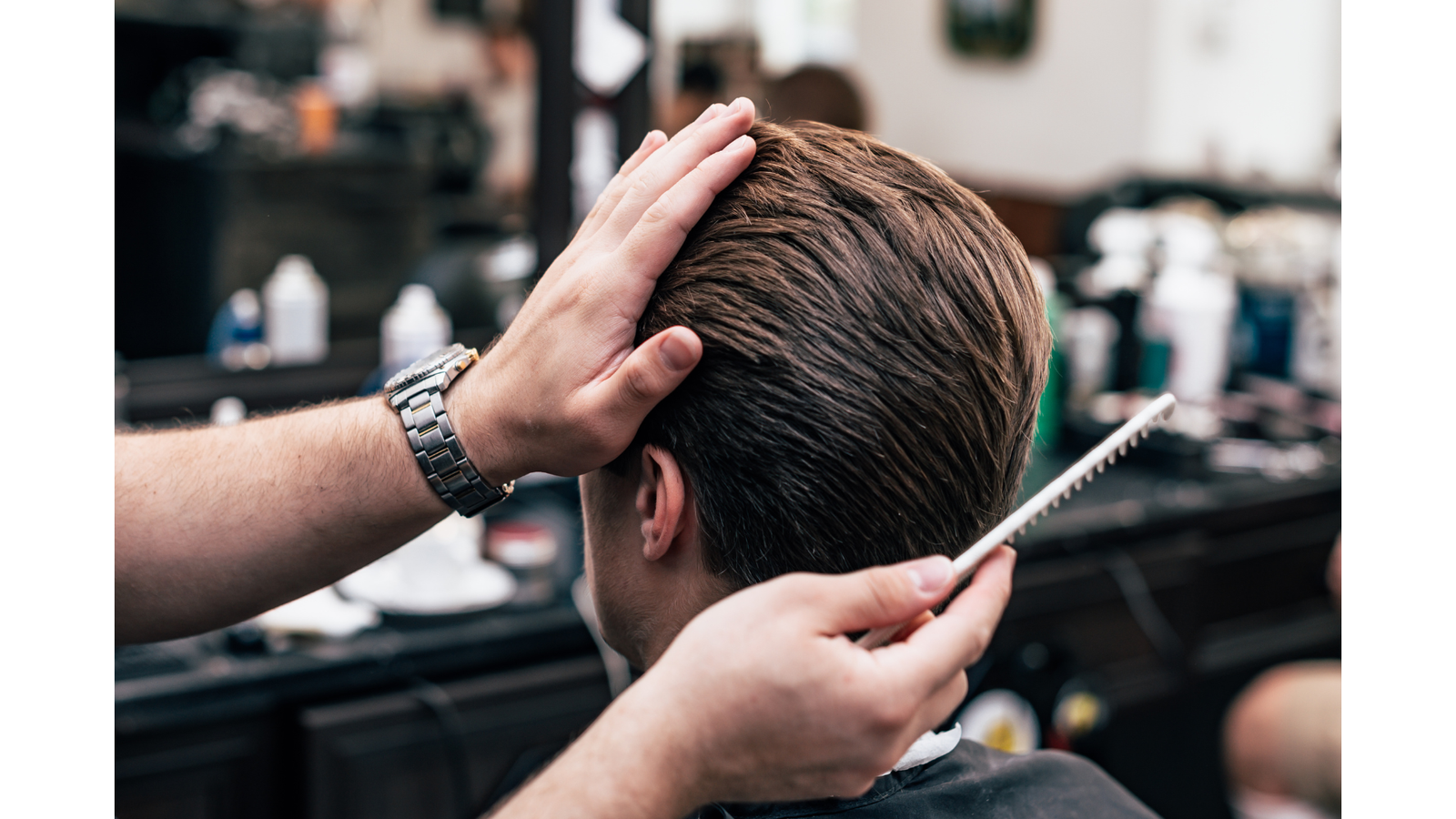 men's combing hair wax product into hair